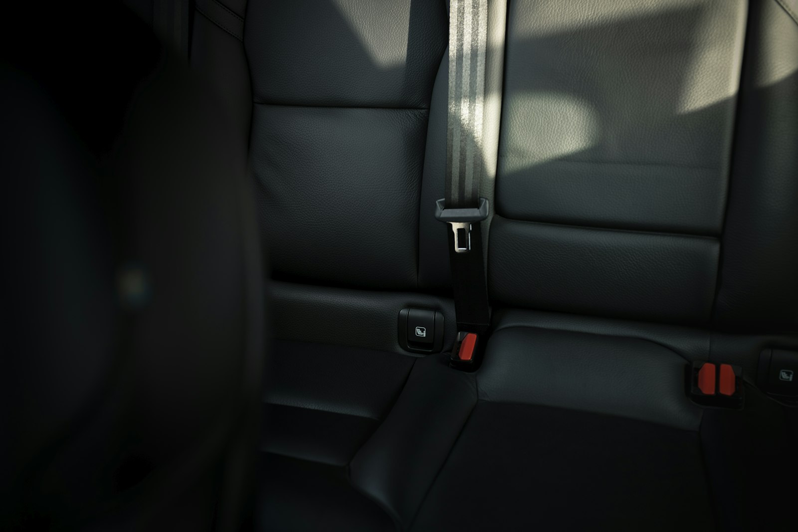 A seatbelt buckled in a car seat